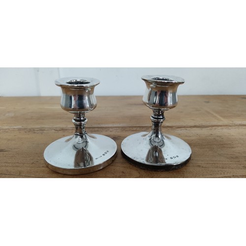 567 - A pair of Sterling Silver candlesticks stamped for Birmingham - 'S.B & S. Ld'.