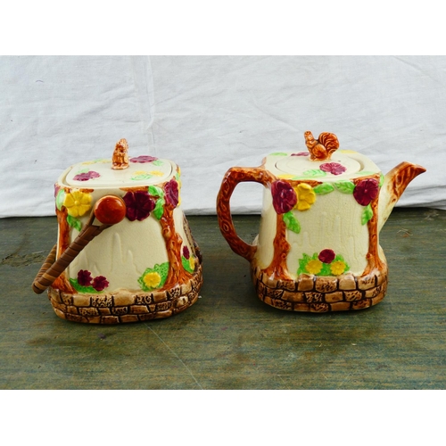 60 - An antique Wade Heath pottery teapot and matching biscuit barrel.