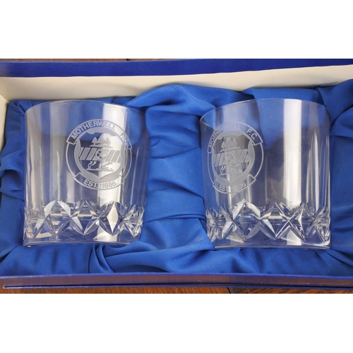 24 - A boxed set of Motherwell F.C. glasses.