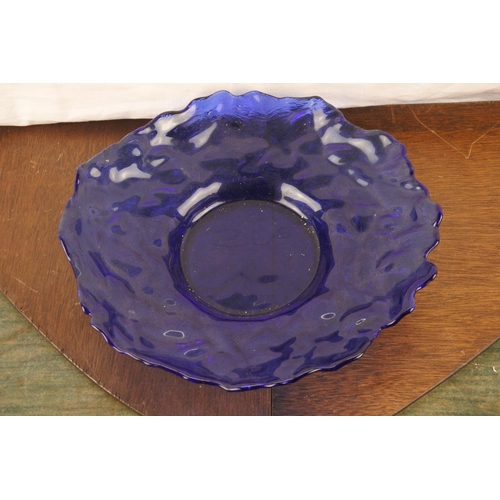 44 - A large vintage blue glass dish. (Measuring 32cm).