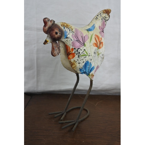 73 - A hand painted metal chicken and another of birds resting on a branch.