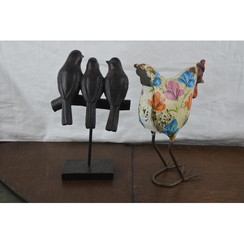 73 - A hand painted metal chicken and another of birds resting on a branch.