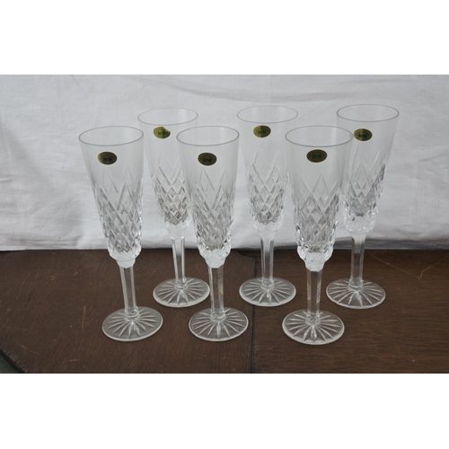 77 - A set of six Tyrone crystal champagne flutes.