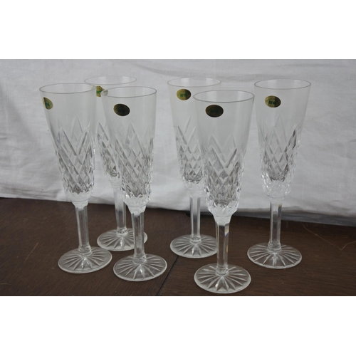 77 - A set of six Tyrone crystal champagne flutes.