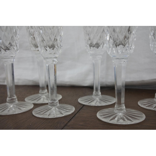 77 - A set of six Tyrone crystal champagne flutes.