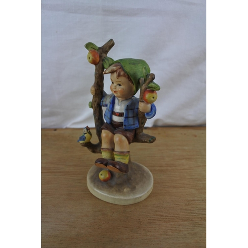 79 - A large Goebel Hummel figurine, 'Apple Tree Boy'.