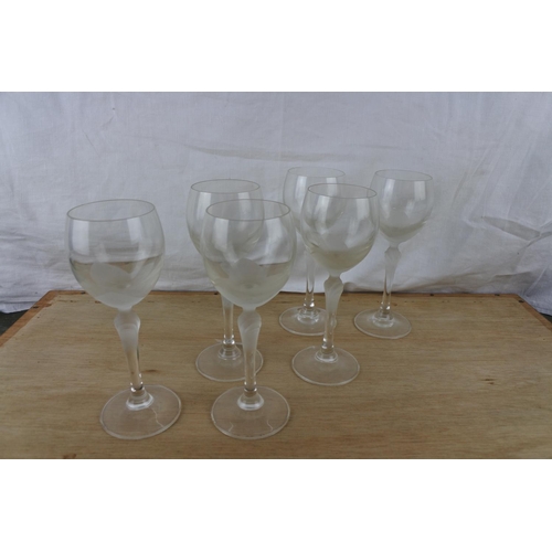 87 - An unusual set of six etched wine glasses.