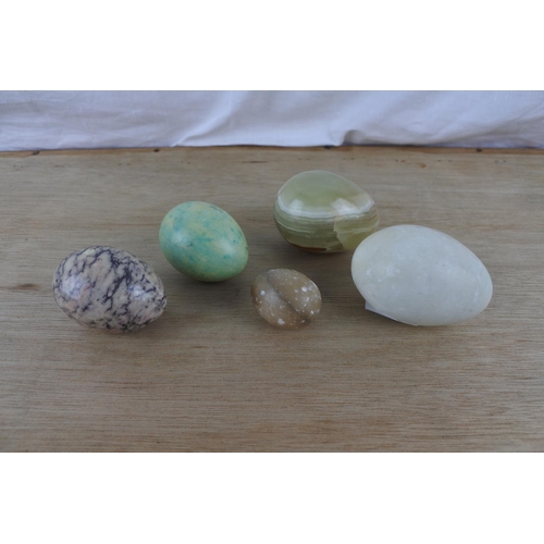 91 - A collection of five marble eggs.