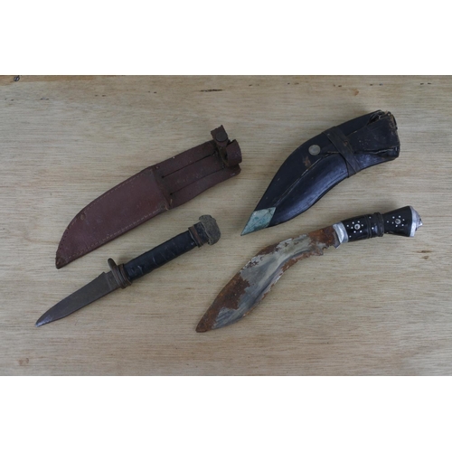 93 - Two dagger in leather sheaths.