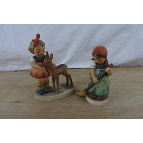 99 - Two Goebel Hummel figurines 'Girl with Deer' and 'Little Sweeper' (a/f).