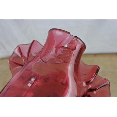 65 - A large antique ruby glass jug with hand painted floral detail (a/f).