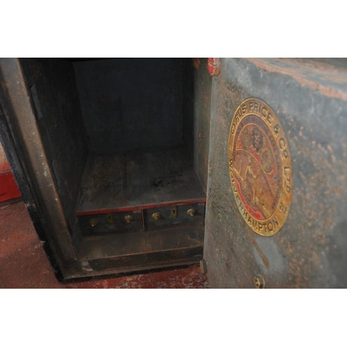 1001 - An antique Cyrus Price & Co safe with key. (Measuring 67x51x55cm).