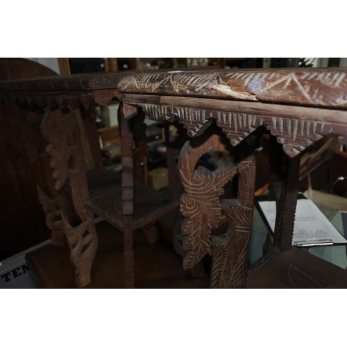 620 - A stunning pair of unusual carved tables, with African Animals carved to tops.