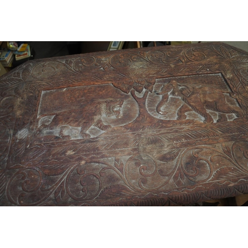 620 - A stunning pair of unusual carved tables, with African Animals carved to tops.