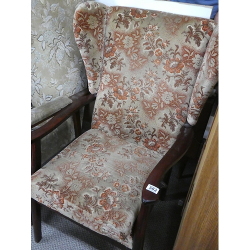 582 - A vintage fireside chair.