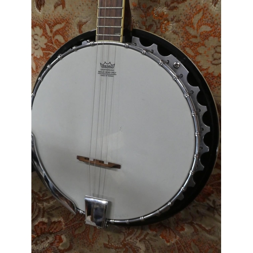 583 - A bottle top banjo.