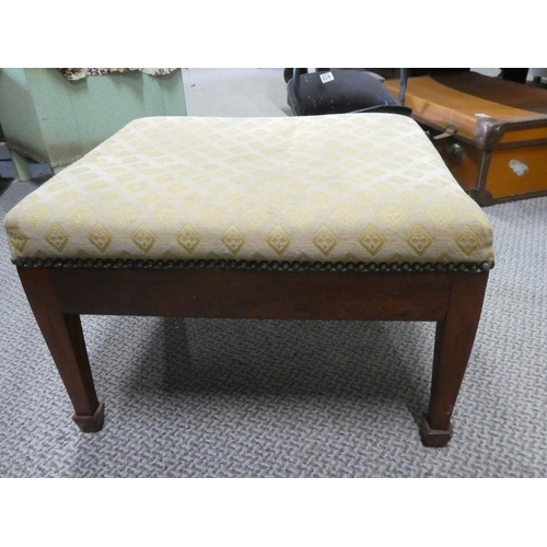 614 - An antique footstool.