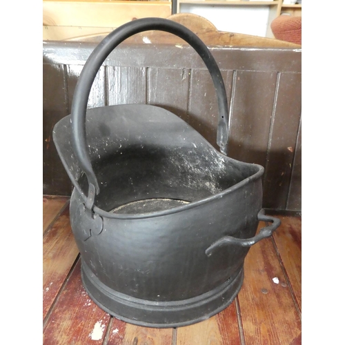 615 - A helmet coal scuttle.