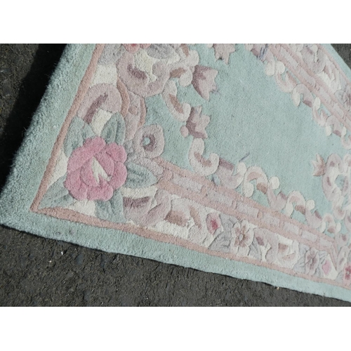 617 - A decorative hall runner rug. (Measuring 210cm).