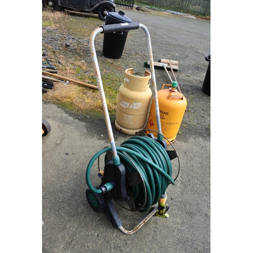 994 - A garden hose & reel.