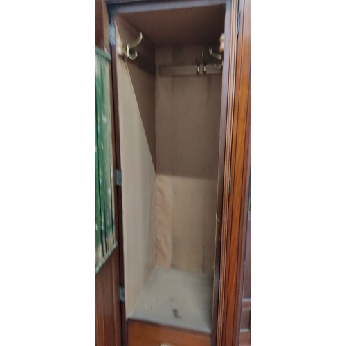 995 - A stunning antique triple wardrobe with mirror door, in need of some restoration.