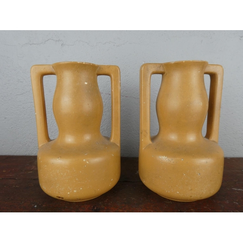 101 - A pair of vintage Dane hand painted vases, measuring 19cm tall.