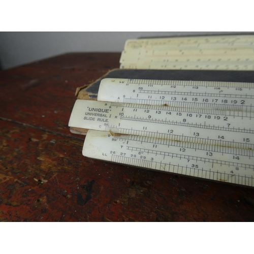 103 - Two boxed vintage slide rulers.