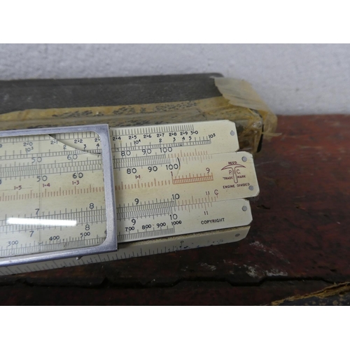 103 - Two boxed vintage slide rulers.