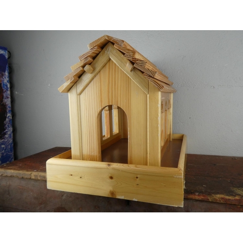 120 - A wooden bird house.
