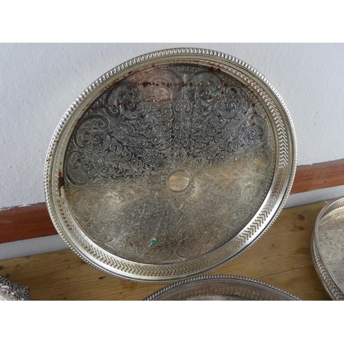 124 - An assortment of silver plated trays.