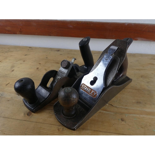137 - Two Stanley wood planes and saw.