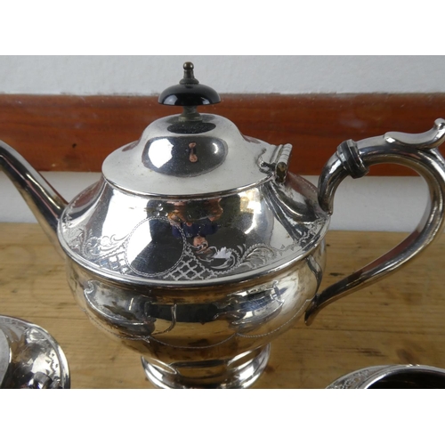 154 - A three piece silver plated tea service.