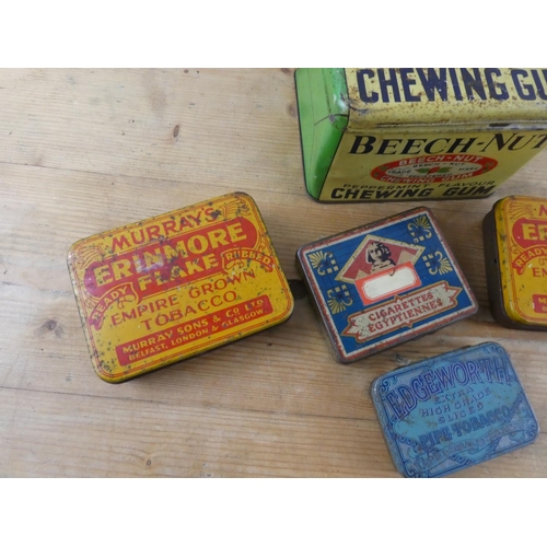 161 - A collection of vintage advertising tins.