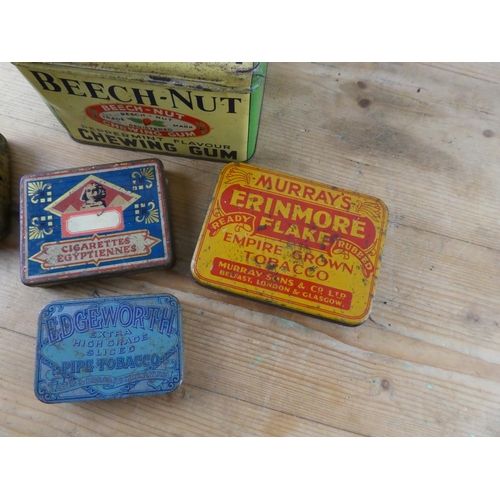 161 - A collection of vintage advertising tins.