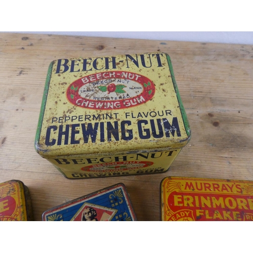 161 - A collection of vintage advertising tins.