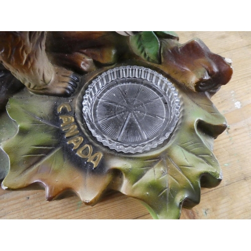 162 - A large chalk souvenir figurine of a bear, 'Canada'.