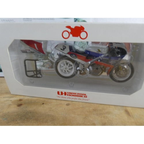 164 - A boxed Universal Hobbies 'Honda RC30 - Joey Dunlop - Isle of Man TT F1 winner'  motorbike and leafl... 