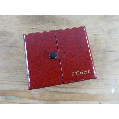 165 - A boxed L'Orient of Singapore gold plated Lotus flower necklace.