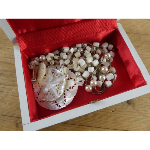 167 - A stunning mother of pearl inlaid jewellery box & contents.