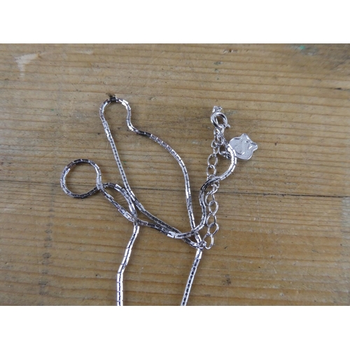 169 - A decorative mother of pearl necklace and chain.