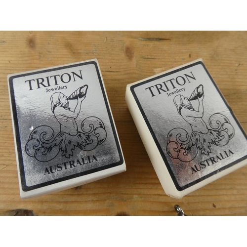 170 - A boxed Triton pendant and necklace and another pendant.
