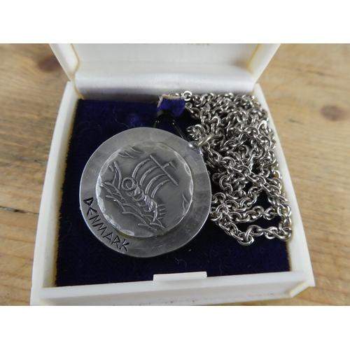 173 - A pewter 'Denmark' pendant and chain.