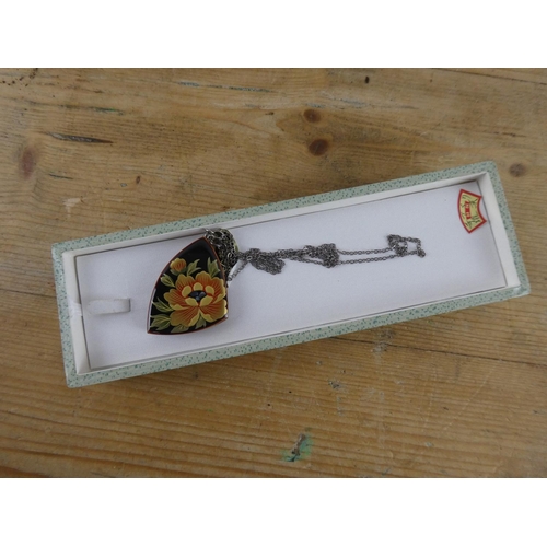 174 - A boxed hand painted pendant and necklace.