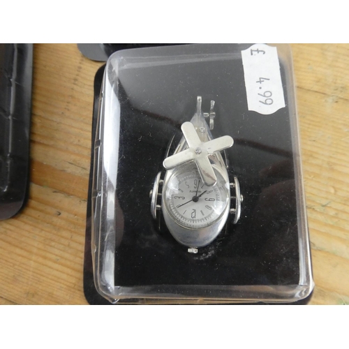 177 - A lot of four boxed miniature clocks.