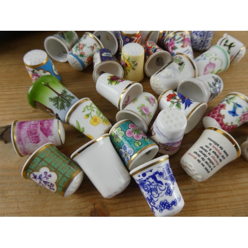 178 - A vintage lidded jewellery box and a large collection of thimbles.