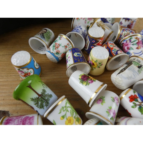 178 - A vintage lidded jewellery box and a large collection of thimbles.