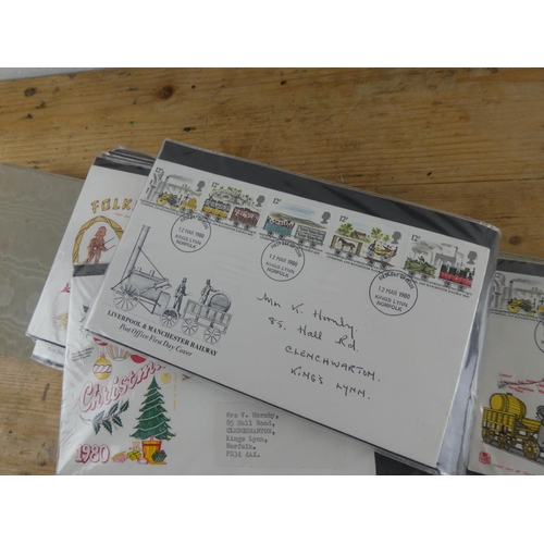 180 - A folder containing a large collection of first day covers.