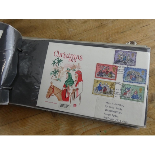 180 - A folder containing a large collection of first day covers.