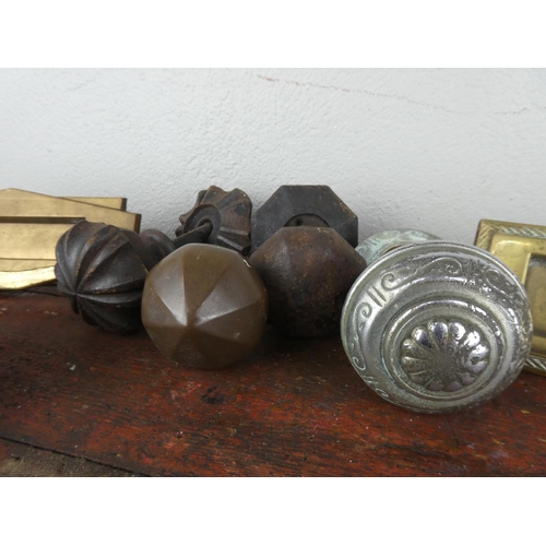 63 - An assorted lot of door knobs, letter boxes and a lion head door knocker.