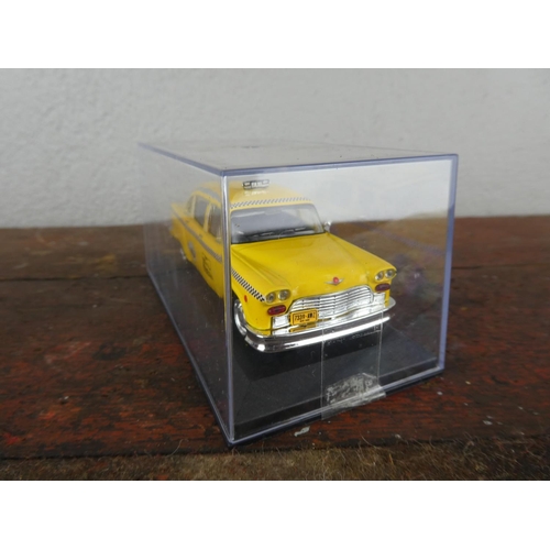 64 - A cased collectors car, 'Checker - New York - 1980'.